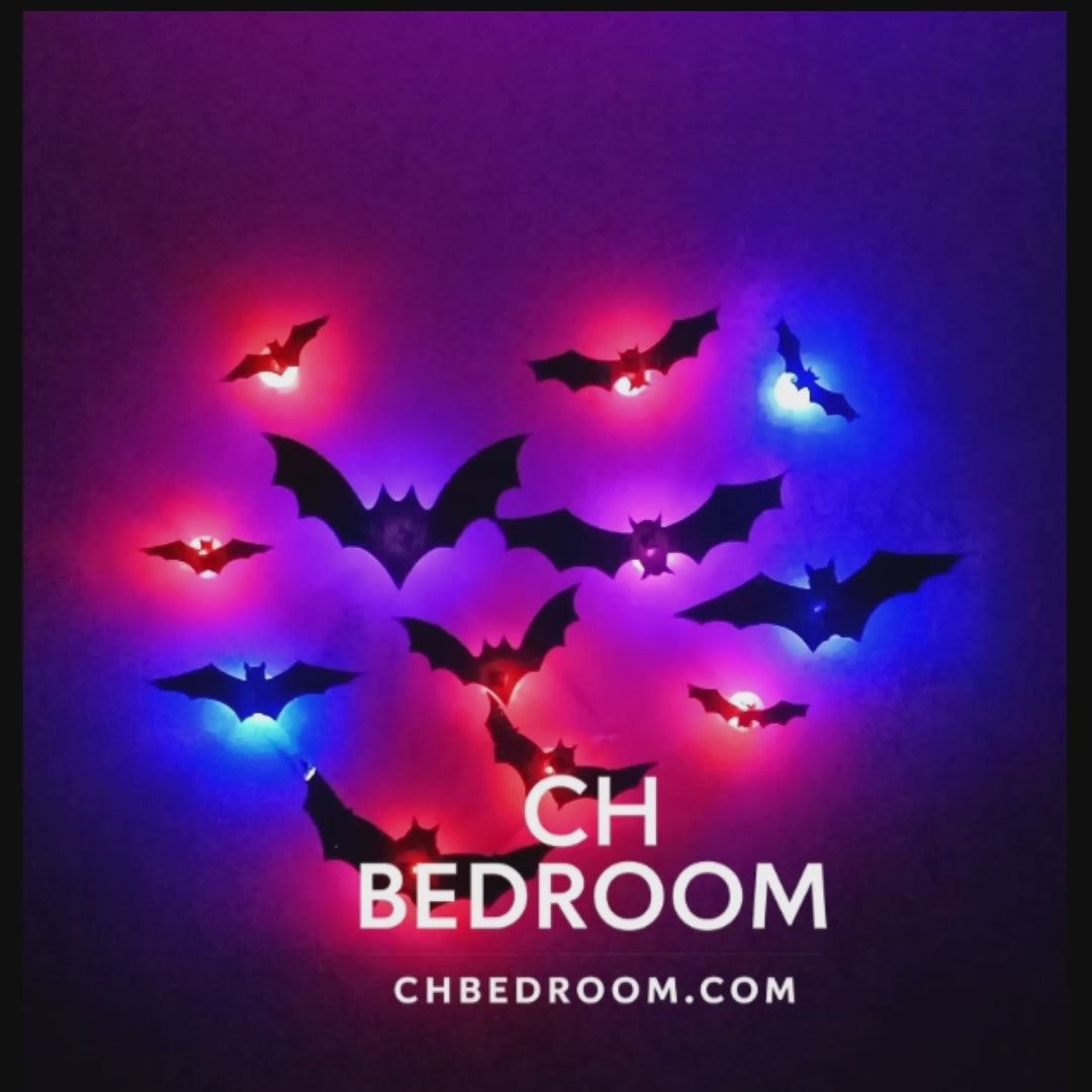 Video of 12 3D halloween led bats on a wall, blue and red light